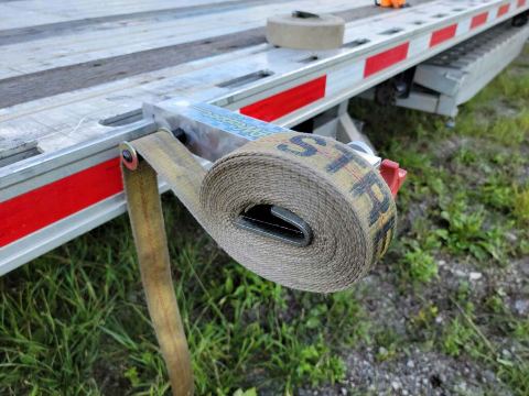 Wrapped nylon cargo strap on the StrapWrapper, out of the weather and ready for next use