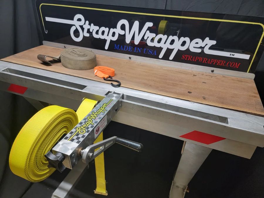 StrapWrapper 2 inch model, aluminum body with black crank handle, shown from above